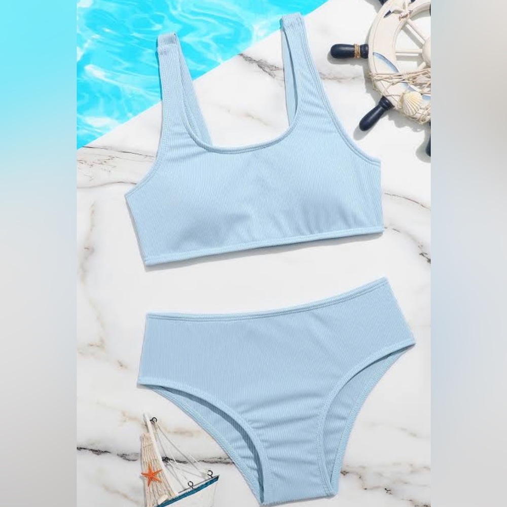 Two piece girls blue bathing suit.